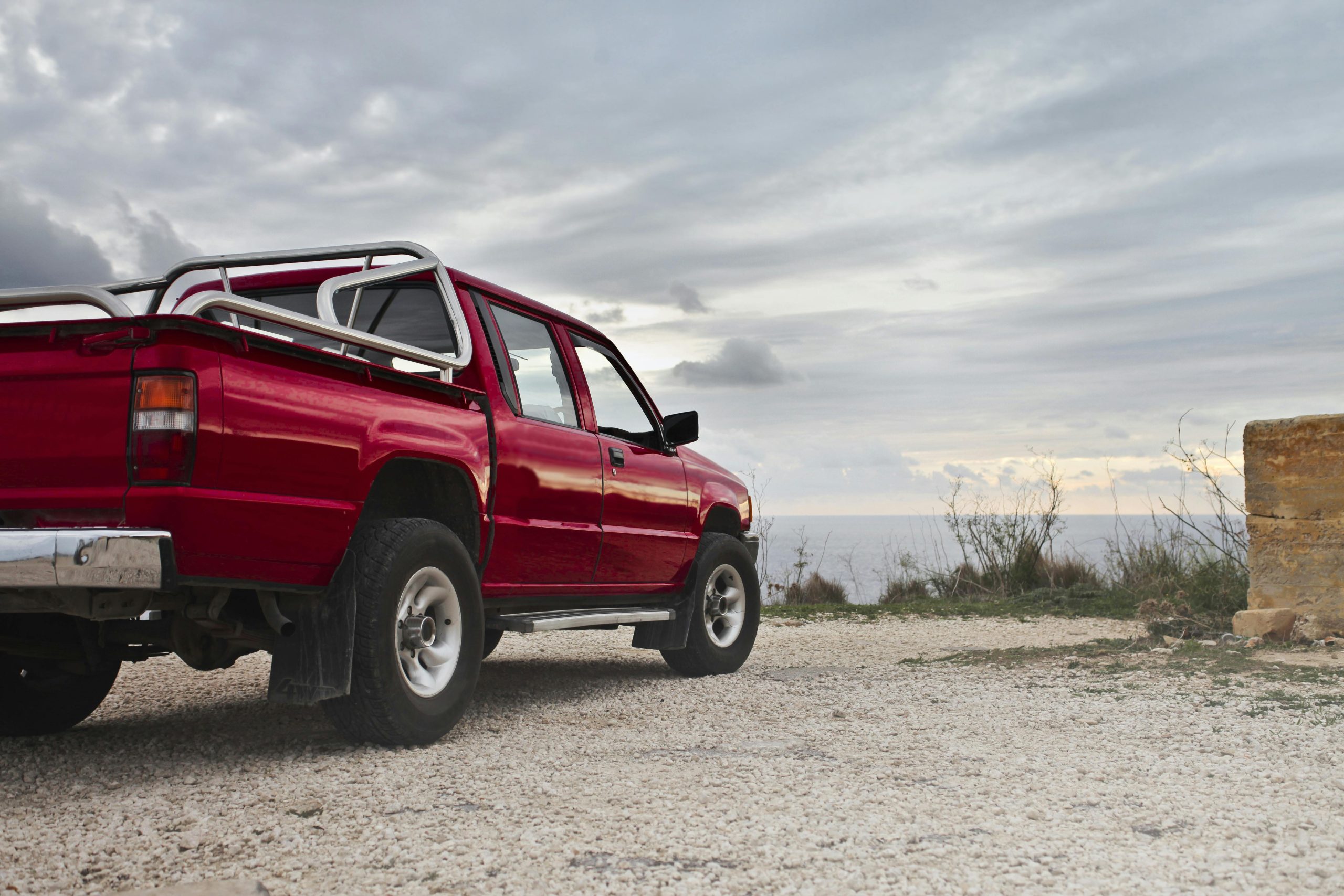 red truck with clouds